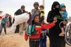 Syrian refugees arrive in early May at a camp on the border in Royashed, Jordan.