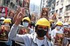  Demonstrators flash the three-finger salute March 1, 2021, during a protest against the military coup in Yangon, Myanmar.