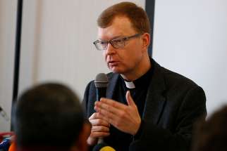 Jesuit Father Hans Zollner, a professor of psychology and president of the Centre for Child Protection at the Pontifical Gregorian University in Rome, leads a briefing for journalists in Rome Feb. 12, 2019. The briefing was to prepare for the Feb. 21-24 Vatican meeting on the protection of minors in the church. Father Zollner is on the organizing committee for the meeting. 