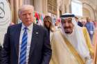 U.S. President Donald Trump walks with Saudi King Salman during the opening session of the Gulf Cooperation Council summit May 21 in Riyadh, Saudi Arabia.