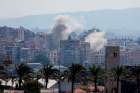 Smoke billows from damaged buildings over southern Lebanon, as seen from Tyre Sept. 25, 2024, following an Israeli airstrike amid ongoing cross-border hostilities between Hezbollah and Israeli forces.