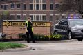 A police officer guards the entrance to the scene of a shooting at the Jewish Community Center of Greater Kansas City in Overland Park, Kan., April 13. A gunman opened fire at two Jewish facilities near Kansas City that day, killing three people, police said.