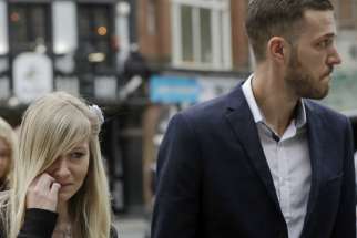 The parents of critically ill baby Charlie Gard, Connie Yates and Chris Gard arrive at the High Court in London, Monday, July 24, 2017