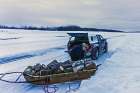 A Catholic missionary gathers firewood in the Northwest Territories. The annual Tastes of Heaven gala to support Canadian missions is going virtual this year.