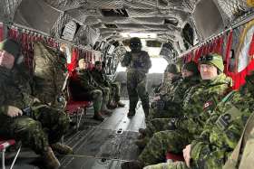 Members of the Royal Canadian Chaplain Service (RCChS) boarding a Chinook Helicopter From 450 Tactical Helicopter Squadron (THS) at Canadian Forces Base Petawawa.