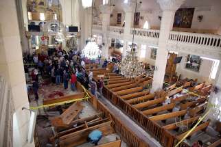 Security personnel investigate the scene of a bomb explosion on April 9 inside the Orthodox Church of St. George in Tanta, Egypt. That same day an explosion went off outside the Cathedral of St. Mark in Alexandria where Coptic Orthodox Pope Tawadros II was presiding over the Palm Sunday service.