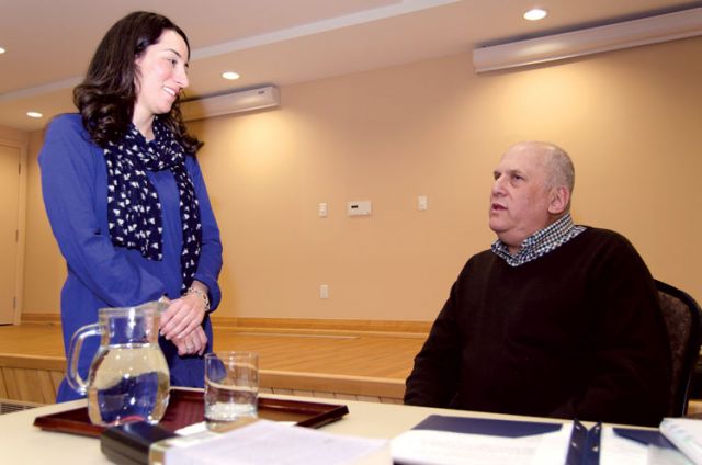 Charles Lewis (right) speaks with one of the event organizers prior to delivering his lecture on euthanasia and the dangers of making it legal. He told about 40 people at Kintore College that legalizing euthanasia in Quebec isn’t a slippery slope, it is the Ice Capades.