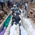 People gather at a mass burial for the victims killed during an artillery barrage from Syrian forces in Houla, Syria, in this handout image dated May 26. Pope Benedict XVI joined the international community in condemning a massacre in Houla, Syria, May 2 5-26, which left about 108 people dead, including 49 children and 34 women. 