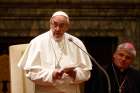 Pope Francis speaks during an audience to exchange Christmas greetings with members of the Roman Curia in Clementine Hall of the Apostolic Palace at the Vatican Dec. 22.