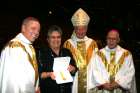 Shirley Leon receives a papal medal of honour for her efforts to promote peace and reconciliation. Archbishop Michael Miller, Cardinal Marc Ouellet and Archbishop Raymond Roussin are shown with her.