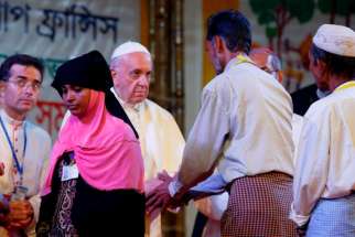 Pope Francis meets Rohingya refugees from Myanmar during an interreligious and ecumenical meeting for peace in the garden of the archbishop&#039;s residence in Dhaka, Bangladesh, Dec. 1. 