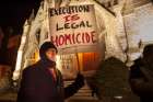 A man protests during a vigil held outside St. Louis University College Church ahead of the 2014 execution of death-row inmate Herbert Smulls of St. Louis. The revision to section 2267 in the Catechism of the Catholic Church, which took effect Aug. 2, calls capital punishment &quot;an attack on the inviolability and dignity of the person,&quot; and commits the church to work &quot;with determination&quot; for the worldwide abolition of the death penalty.