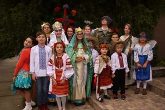 Children who perform in the Ukrainian Christmas play, vertep, pose for a photo Dec. 11 in Sacramento, Calif.