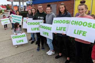 Participants hold signs during the 2019 Life Chain in Abbotsford, British Columbia. The annual event will be held across Canada and throughout North America Oct. 4, 2020, despite a surge in the number of COVID-19 cases in Canada&#039;s largest provinces.