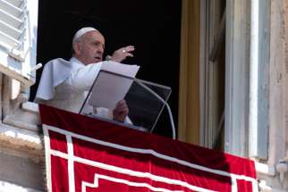 Pope Francis gives a blessing as he leads the Angelus from the window of his studio overlooking St. Peter&#039;s Square at the Vatican June 30, 2019.