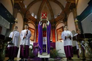 A priest celebrates Mass Dec. 4, 2016 in the Cathedral of the Immaculate Conception in Beijing. 