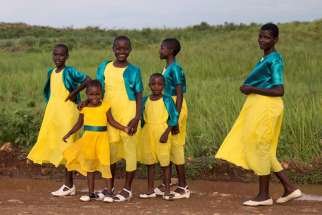 Girls are seen walking near Kisumu, Kenya, in this 2017 file photo. Catholic doctors in Kenya have warned against a mass cervical cancer vaccination program for young girls, as the government accelerates plans to roll out the program in September.