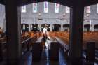 An electrostatic disinfectant is applied to the pews at Christ the King Church in Nashville, Tenn. Bishop J. Mark Spalding has reinstated public Masses in the diocese at the discretion of pastors.