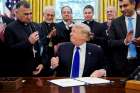 Chaldean Catholic Archbishop Bashar Warda of Irbil, Iraq, holds the pen given to him by U.S. President Donald Trump Dec. 11 after Trump used it to sign into law the Iraq and Syria Genocide Relief and Accountability Act of 2018 at the White House in Washington. The bill will provide humanitarian relief to genocide victims in Iraq and Syria and hold accountable Islamic State perpetrators of genocide. 