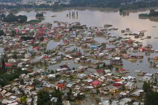 This aerial view taken Sept. 10 shows houses submerged by floodwater in Srinagar, India. While nearly 250 people have perished in the floods following rains in the Kashmir Valley in the foothills of the Himalayas, more than 700,000 people have been maroo ned on rooftops, trees and hills since Sept. 7.