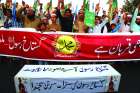 Men and boys protest in Karachi, Pakistan, Nov. 4, days after a court acquitted Asia Bibi. 