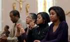 A family prays before Sunday Mass starts at St. Joseph&#039;s Catholic Church in Alexandria, Va., Nov. 27, 2011.