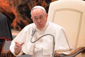 Pope Francis gestures during a Nov. 21 audience for participants in a world congress sponsored by the Congregation for Catholic Education in the Paul VI hall at the Vatican.