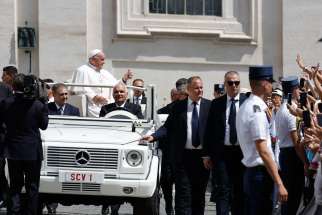 Pope Francis greets visitors as he rides the popemobile in St. Peter&#039;s Square after his weekly general audience at the Vatican June 26, 2024.