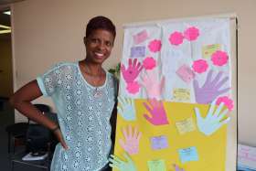 Carol Soares displays an activity from a workshop at Michael Power/St. Joseph High School.