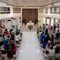 Franciscan Father Jesus Galindo, chaplain of Makati Medical Center in Manila, Philippines, celebrates Mass May 12 in the lecture hall of the facility. Some Catholics in Philippines prefer Masses in places other than regular parish churches.