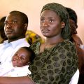 Patient Alpha Samuel holds her 6-month-old son Richard as she listens to a presentation at Our Lady of Apostles Hospital in Akwanga, Nigeria