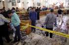 Security personnel investigate the scene of a bomb explosion April 9 inside the Orthodox Church of St. George in Tanta, Egypt April, 9.