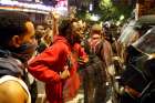 A man confronts riot police during Sept. 21 protests in Charlotte, N.C., after police fatally shot Keith Lamont Scott in the parking lot of an apartment complex.