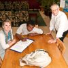 Team leader Julie Neubauer, left, and Bruce Rivers, right, sit down with Michael, a Covenant House resident.