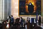 People maintain physical social distancing as they attend Mass for the first time in two months at a church in Madrid May 18.