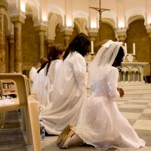 Candidates for Christian initiation pray ahead of their confirmation during Pentecost service at a church in Beirut May 27. Among those entering the church was Thomas, a Yemen-born Muslim who had fled his home country because of his desire to become a Christian.