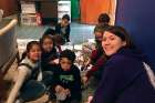 A youth volunteer facilitates an arts and crafts activity for the day campers at St. Monica’s parish. Youth minister Beki Moynihan says Camp Monica is an opportunity to build community with its younger parishioners.