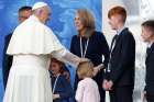 Pope Francis greets family members as he visits the Knock Shrine in Knock, Ireland, Aug. 26. 