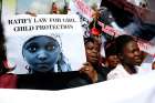 Women holding signs take part in a May 5 protest in Lagos, Nigeria, to demand the release of abducted high school girls. The Islamist militant group Boko Haram claimed responsibility for the abduction of 276 schoolgirls during a raid in the remote villag e of Chibok in April. 