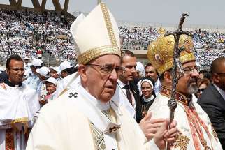 Pope Francis arrives in procession to celebrate Mass at the Air Defence Stadium in Cairo April 29.