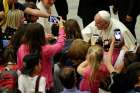 Pope Francis poses for a selfie as he arrives to lead a special audience for members of a middle school group June 2 at the Vatican. The middle-schoolers were part of Communion and Liberation&#039;s &quot;The Knights of the Grail&quot; educational initiative. 