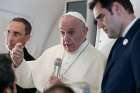  Pope Francis answers questions from journalists aboard his flight from Abu Dhabi, United Arab Emirates, to Rome Feb. 5, 2019. Also pictured are Msgr. Mauricio Rueda, papal trip planner, and Alessandro Gisotti, interim Vatican spokesman. 