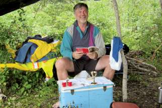 Fr. Jim Kaptein uses a cooler as a makeshift altar in the wild.