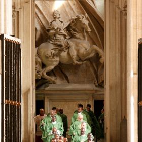 Gian Lorenzo Bernini&#039;s statue of the Roman Emperor Constantine is seen in the portico of St. Peter&#039;s Basilica as clergy process during the closing Mass of the Synod of Bishops for Africa at the Vatican in this Oct. 25, 2009, file photo. The statue shows Constantine looking at the appearance of a cross in the sky in Rome in 312, an event that led to his conversion and the legalization of Christianity.