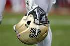 A New Orleans Saints player is seen holding his helmet during the second half of a game in 2019. In a Jan. 24, 2020, story, The Associated Press claimed the Saints&#039; owner, a devout Catholic, has aided the New Orleans Archdiocese in trying to shield emails related to the sex abuse crisis. The archdiocese in a statement called the story false, saying its only advice on the matter was to &quot;be direct, open and fully transparent.&quot;