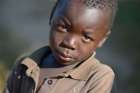 A young boy in a 2017 photo in Jombo, Malawi. With assistance from the AIDS program of the Church of Central Africa Presbyterian, a sexual and reproductive health club for children and youth operates in the village. It allows young people to educate their peers about avoiding HIV transmission, resisting early marriages, and the prevention of early school dropouts.