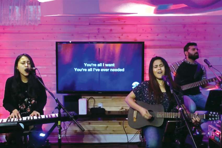 The band iv24 is creating spiritual communion during the COVID-19 crisis by hosting virtual prayer and worship sessions on Facebook every Friday night. From left are Desiree D’Cunha, Whitney D’Cunha and Rudy D’Souza.