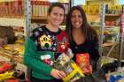 Alexandria Hamelin (right) works with one of the 30 volunteers of the Georgian Bay Food Network on Dec. 13 to prepare bags filled with items and ingredients to make a traditional Christmas turkey dinner. ShareLife food security grants are helping this program this Christmas season.