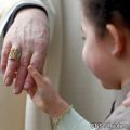 A child shakes hands with Cardinal Sean Brady following a 2010 Mass. A leading international expert on child protection appealed to Irish bishops to cooperate with the church&#039;s own watchdog.