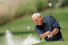 Former champion Arnold Palmer of the U.S hits from a sand trap during the 2008 annual Masters Par 3 golf tournament at the Augusta National Golf Club in Georgia. Palmer, known as &quot;the King&quot; for his transformative legacy in golf, died Sept. 25 at a Pittsburgh hospital at age 87.